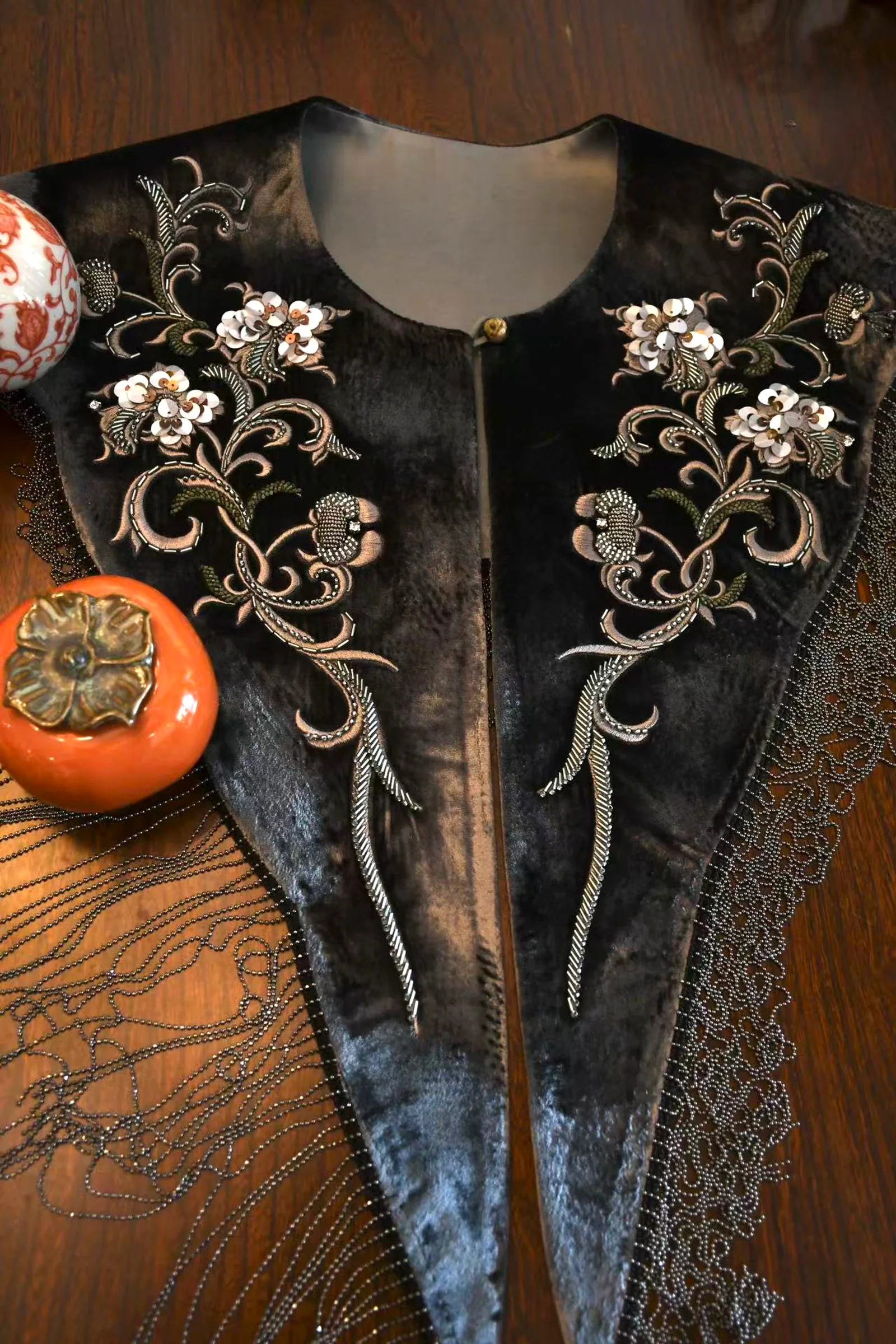 Close view of espresso velvet beaded fringe collar with floral beadwork and fringe